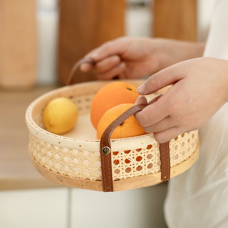 Brown handwoven rattan storage basket – shown in use