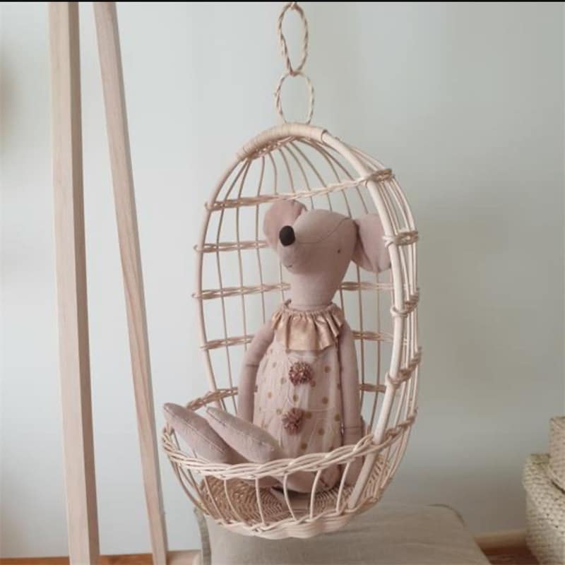 Nordic hanging rattan toy storage basket – shown in a room setting
