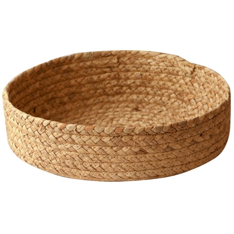 Round handwoven rattan basket with a center handle