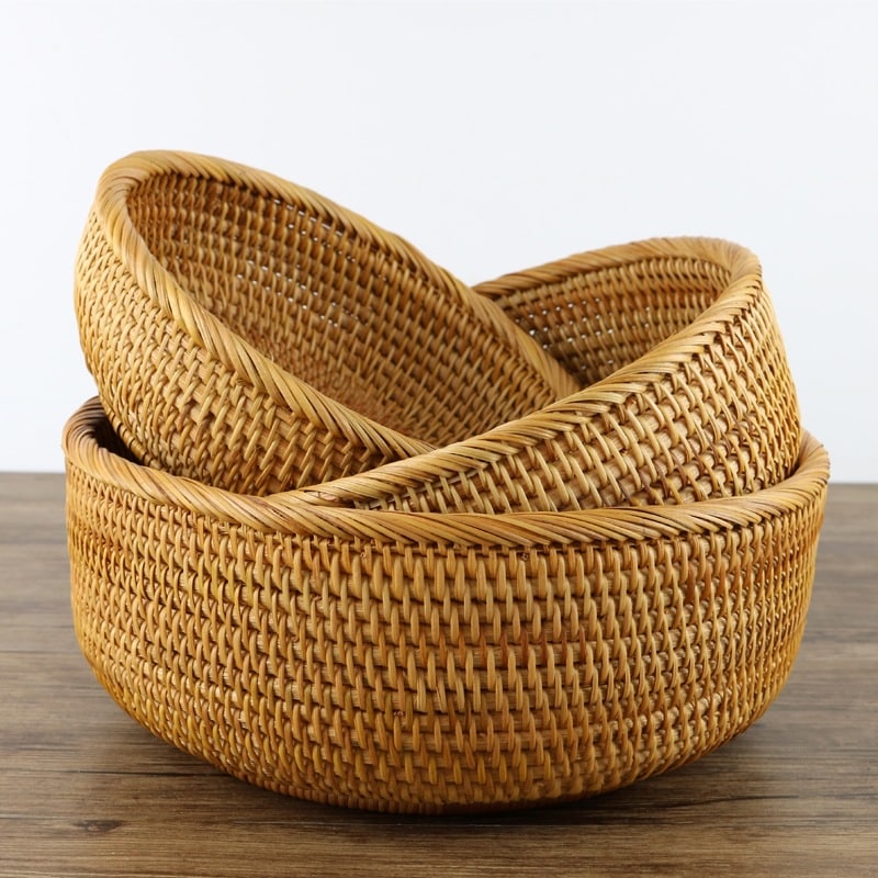 Round woven storage basket in natural rattan and plant fibers – multiple views
