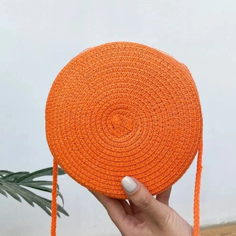 Round orange wicker-look shoulder basket bag – worn by a model (3)