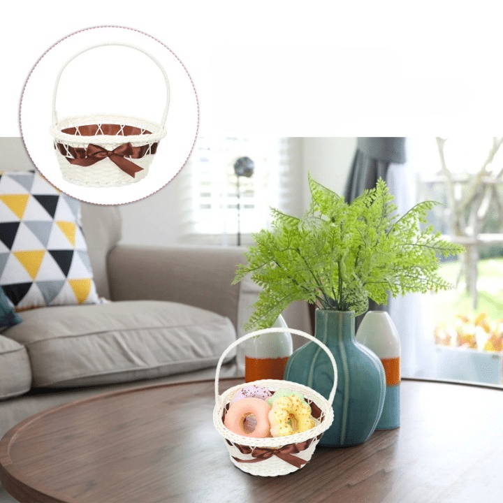 Ivory wicker-look basket with a brown ribbon and handle – shown in a room setting (2)