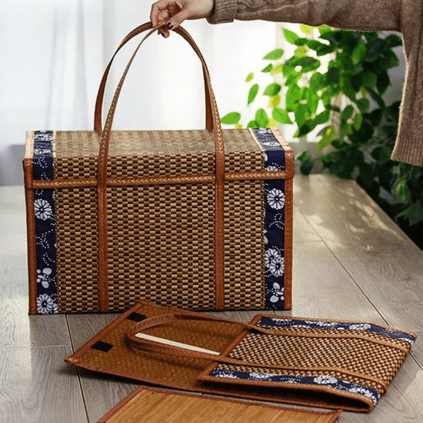 Foldable rattan-look picnic basket with an arched handle – shown in a room setting