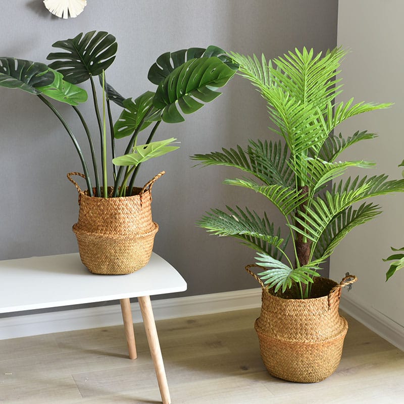 Round handwoven rattan planter basket hiding a plant pot – shown in a room setting (2)