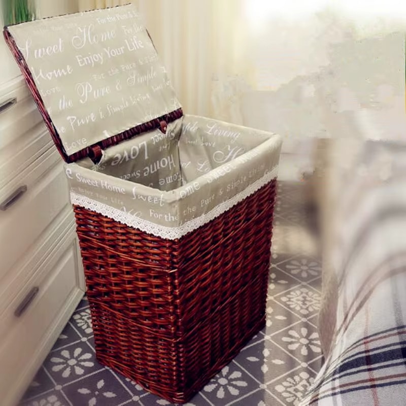 Retro brown rattan laundry basket with a curved lid – shown in a room setting (2)