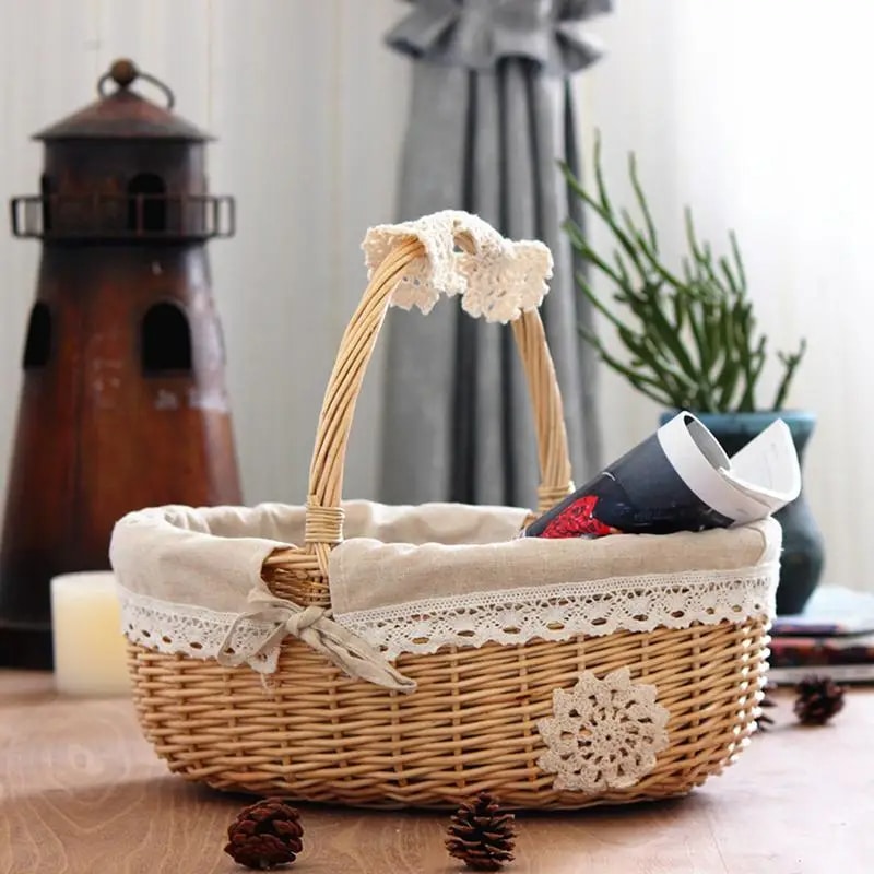 Natural wicker basket with a beige fabric lining and handle – shown in a room setting (2)
