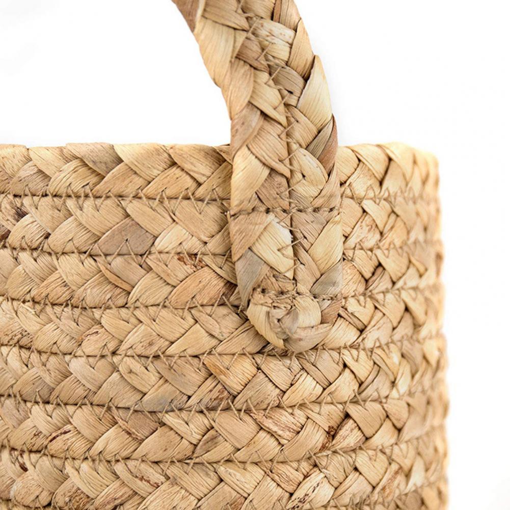 Hand-braided hanging rattan plant basket – close-up detail
