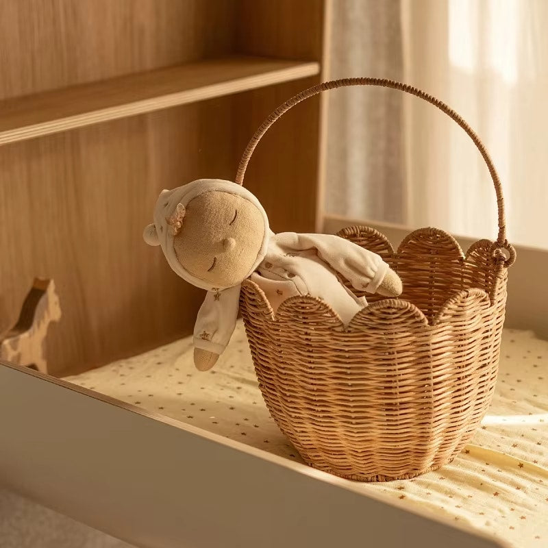 Nordic bamboo storage basket with a braided rope handle in a warm sand tone – shown in a room setting