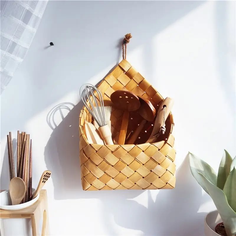 Vintage rattan-look round handwoven storage basket – shown in a room setting (2)