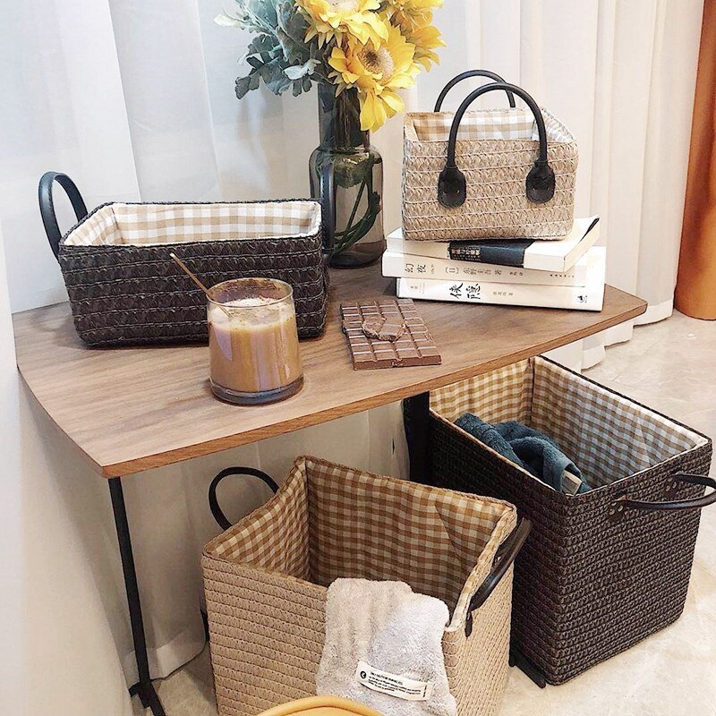 Square hand-braided rattan box basket with two handles – shown in a room setting (3)
