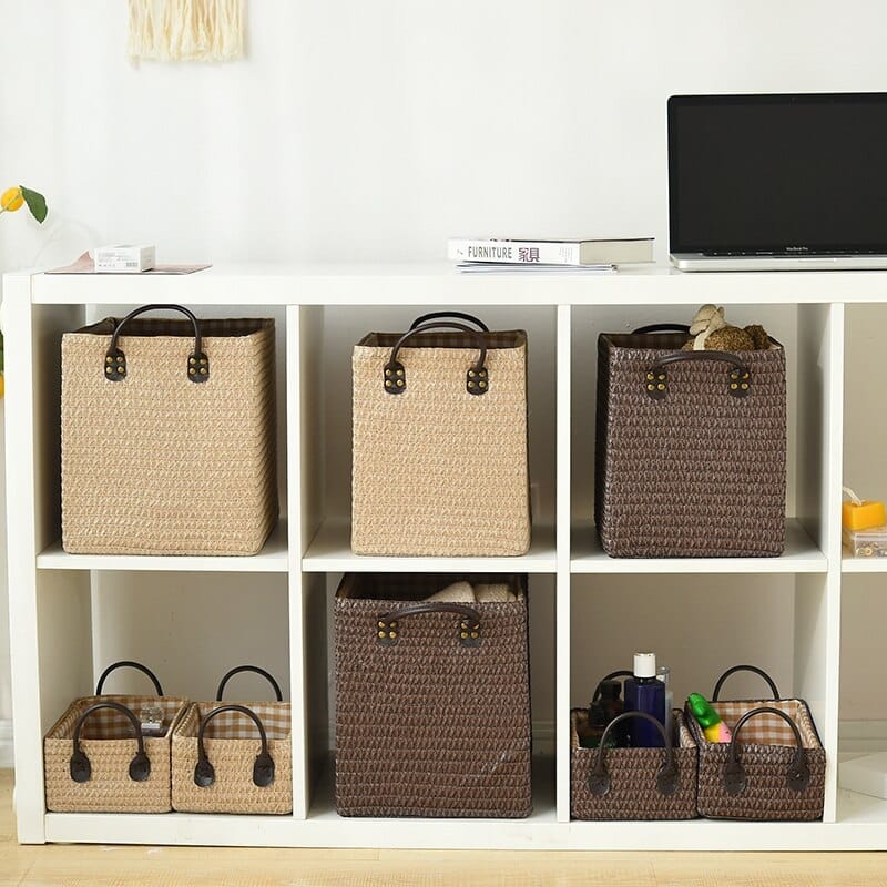Square hand-braided rattan box basket with two handles – shown in a room setting (5)