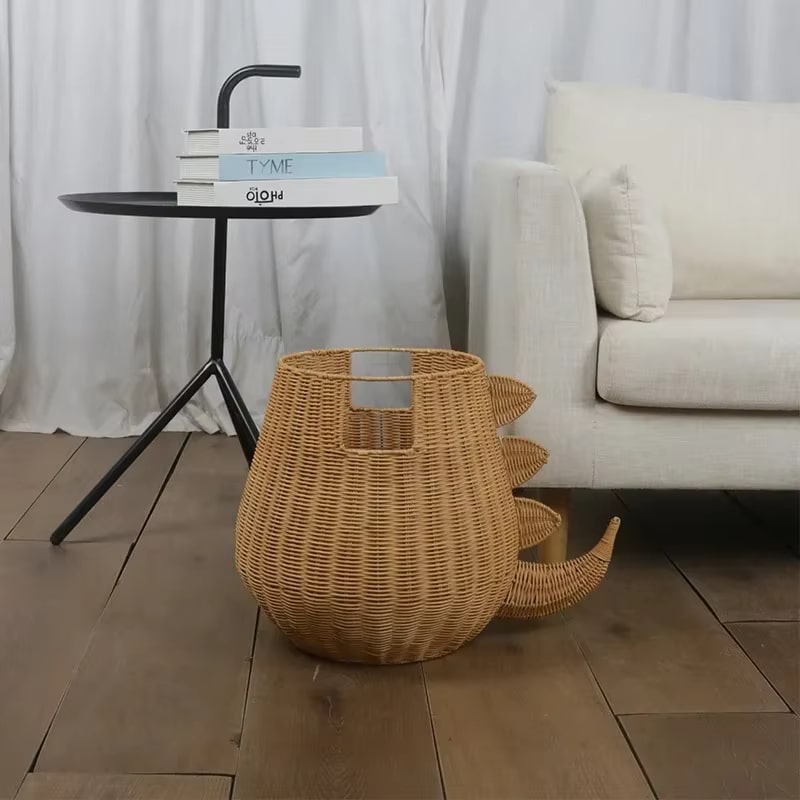 Dinosaur-shaped handwoven rattan toy basket – shown in a room setting (2)