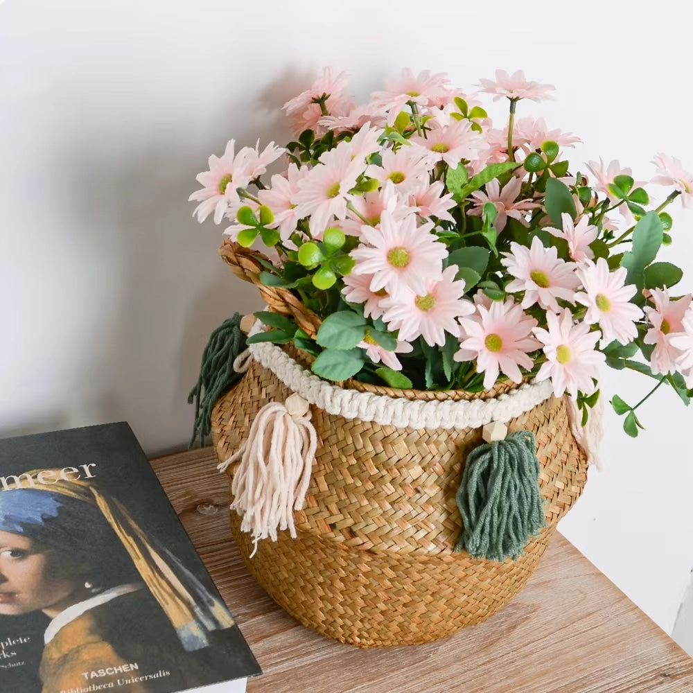 Beige rattan basket with white and green hand-knotted tassels – shown in a room setting