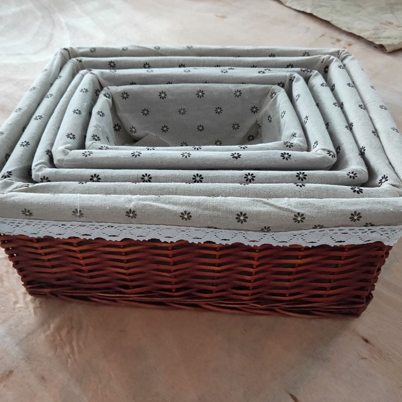 Rectangular rattan storage basket with a removable cotton liner – multiple views