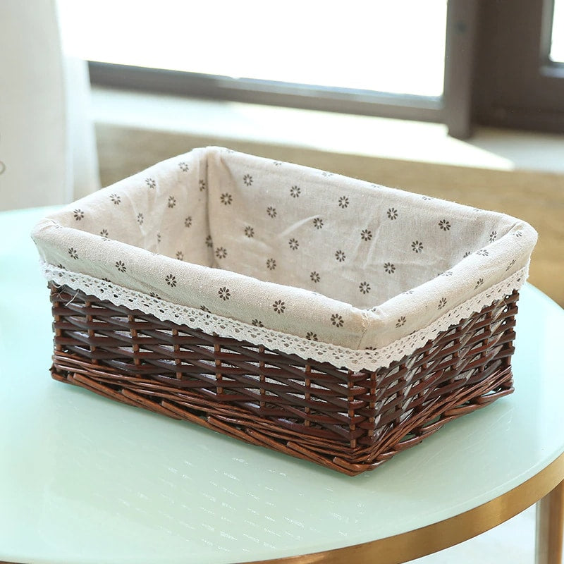Rectangular rattan storage basket with a removable cotton liner – brown variant, shown in a room setting