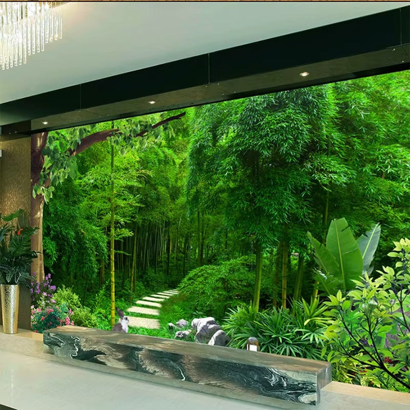 Bamboo forest print wallpaper in layered greens – shown in a room setting