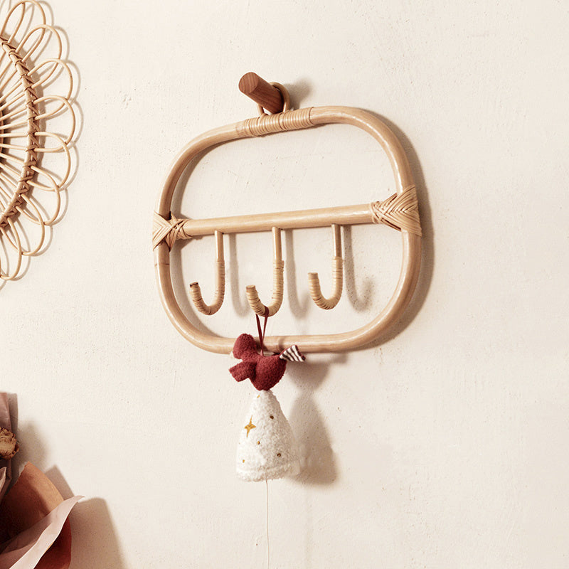 Rectangular natural rattan coat rack with three braided hooks