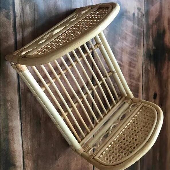 Vintage caned rattan baby bed – close-up detail