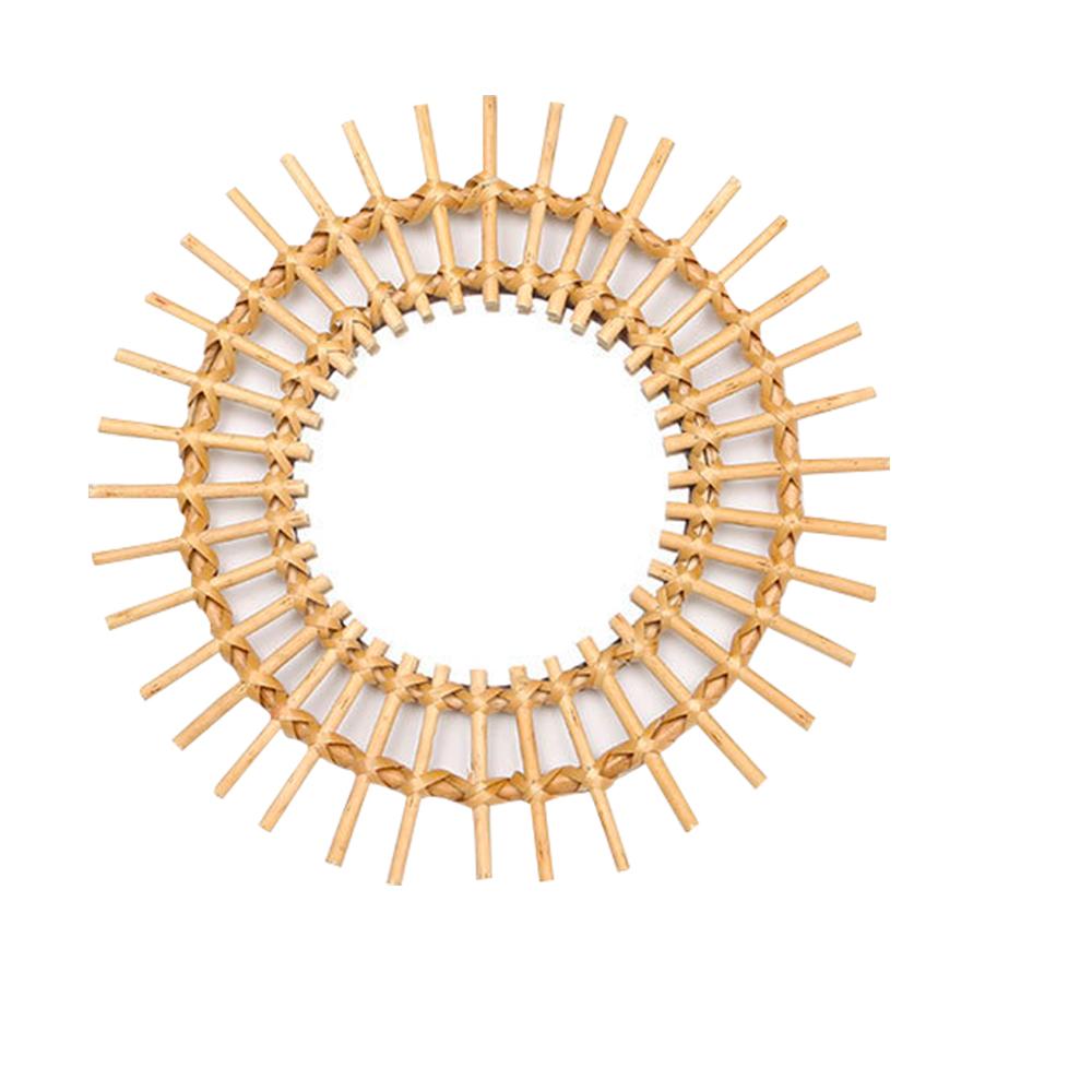 Small golden rattan sun mirror with hand-braided rays