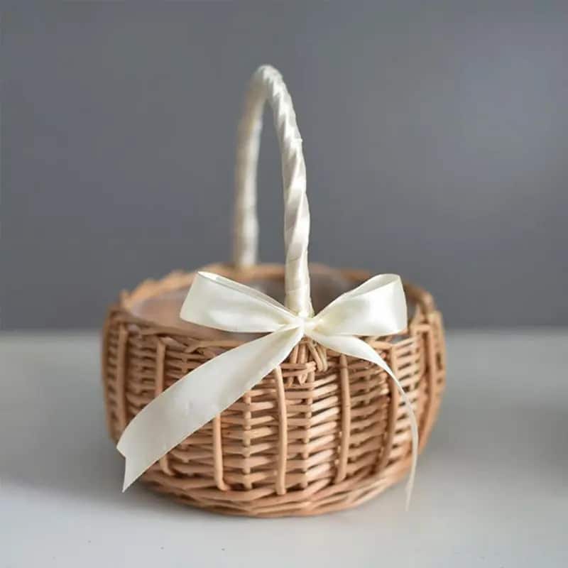Small handmade wicker-look basket with a supple handle