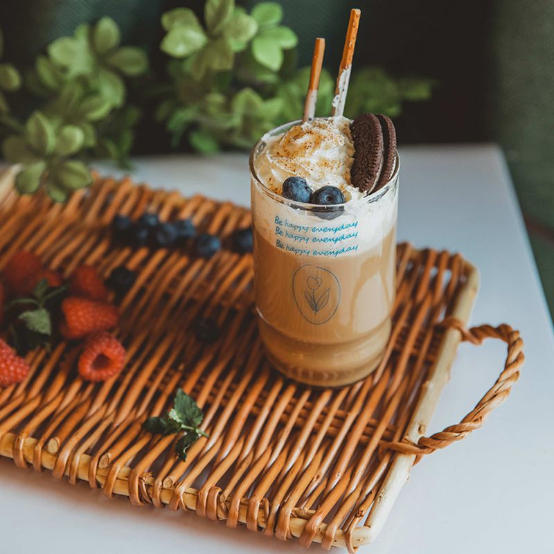 Small slim rectangular rattan tray – shown in a room setting (2)