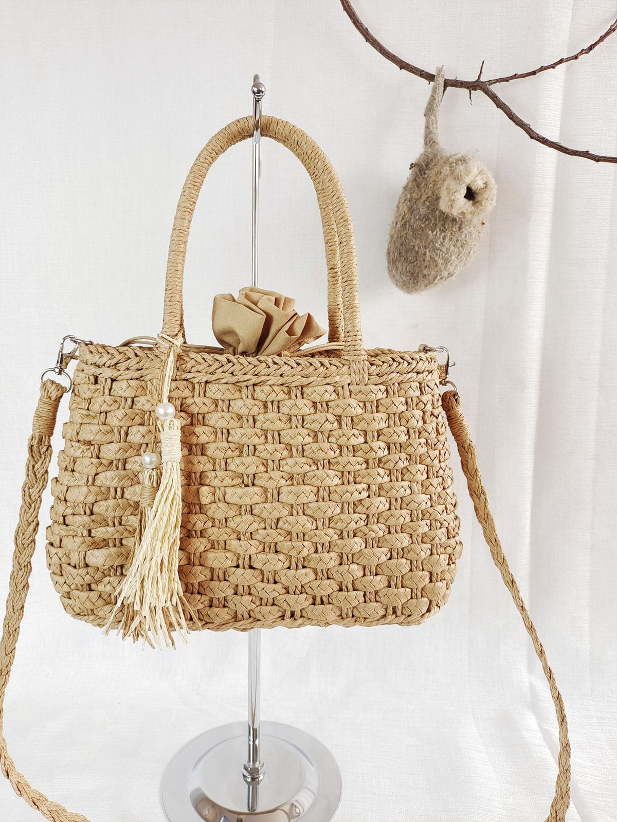 Small rattan handbag with rigid handles and a removable strap – another view