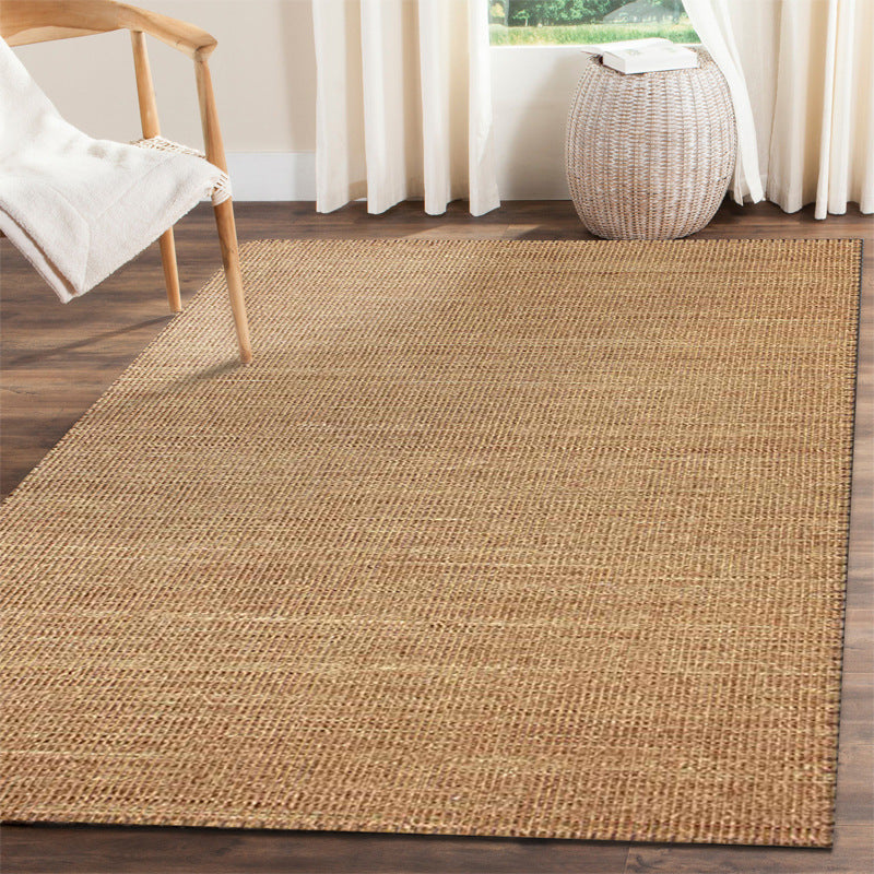 Small rectangular rattan rug with a tight weave – shown in a room setting