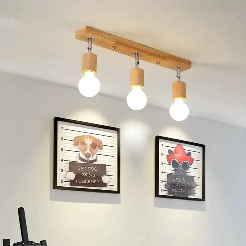 Three-head wood LED ceiling light with adjustable heads – shown lit in a room setting