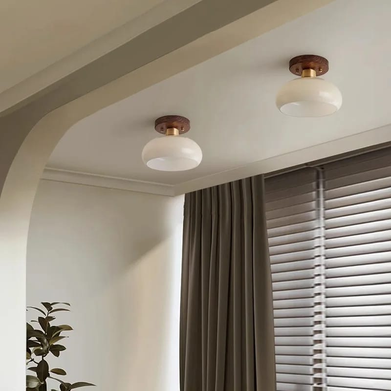 Modern wood frame LED ceiling light with translucent glass stone diffusers – shown lit in a room setting (3)