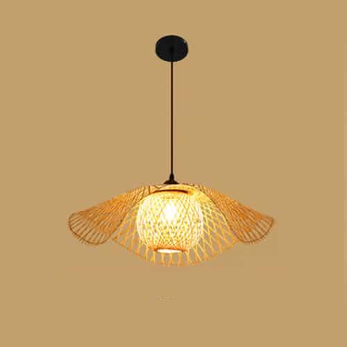 Tropical handwoven rattan ceiling light with a circular weave – shown lit