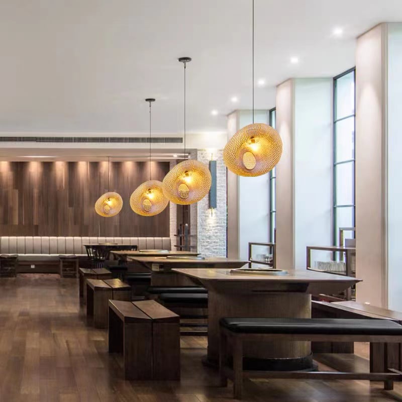 Chinese-style rattan and hand-braided bamboo slat LED ceiling light – shown lit in a room setting (3)