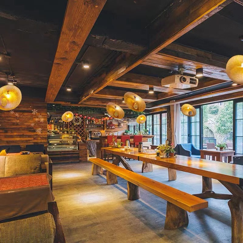 Chinese-style rattan and hand-braided bamboo slat LED ceiling light – shown lit in a room setting (4)
