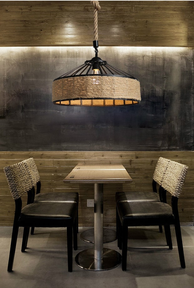 Industrial black frame rattan pendant light hung on raw rope – shown in a room setting (2)