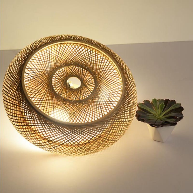 Open-weave hanging rattan ceiling light – close-up detail, lit