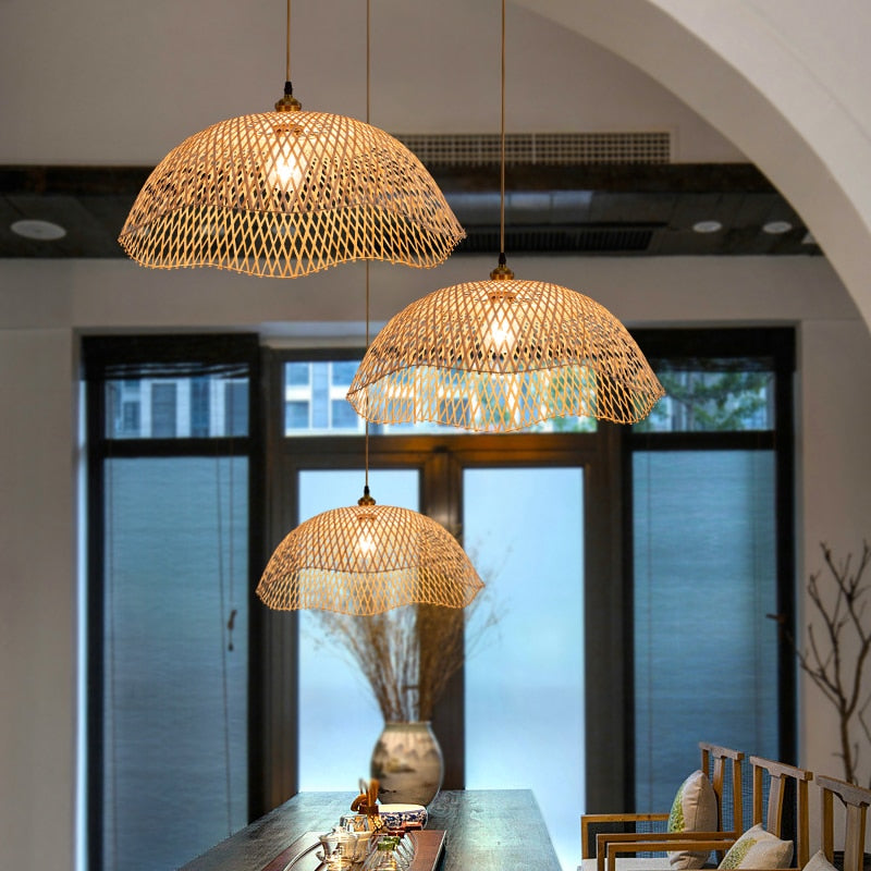 Modern geometric handwoven rattan, wicker and bamboo ceiling light – shown lit in a room setting (3)