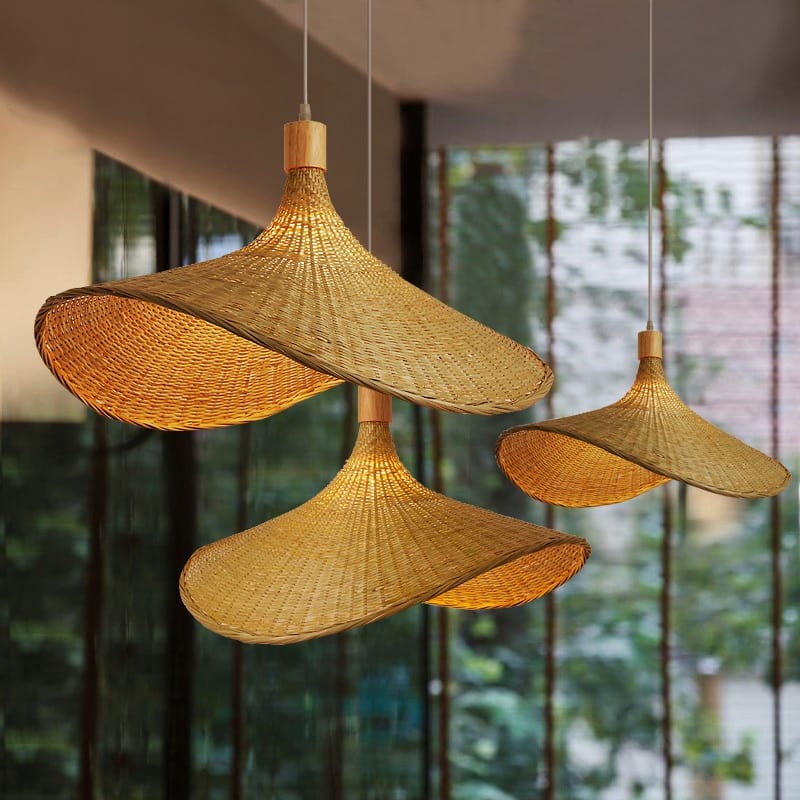 Vietnamese-style handwoven rattan and bamboo ceiling light – shown lit in a room setting