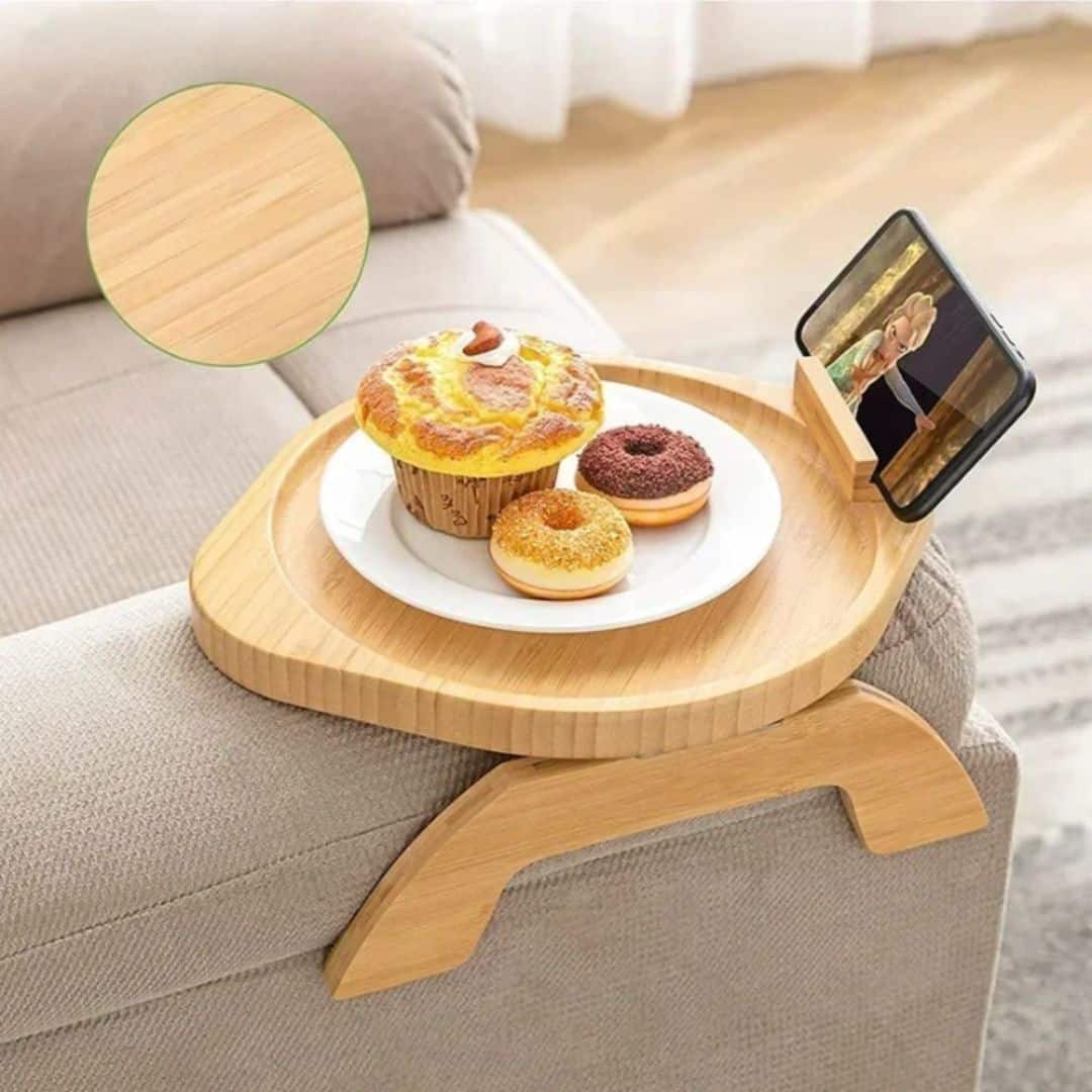 Foldable bamboo bed tray with a tilting phone holder – shown in a room setting