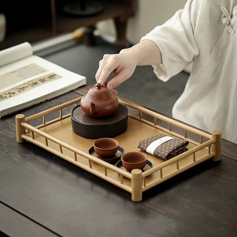 Japanese-inspired rectangular handwoven bamboo tea tray – shown in use