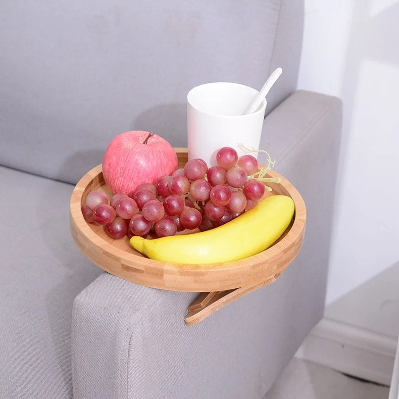Round bamboo tray resting on a sofa armrest – shown in a room setting (3)