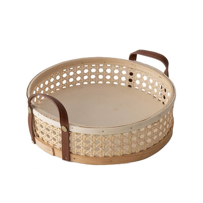 Round white rattan tray with a sewn leather handle