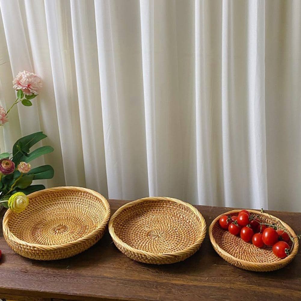 Round genuine rattan tray with natural ribs and a rounded border – shown in a room setting (2)