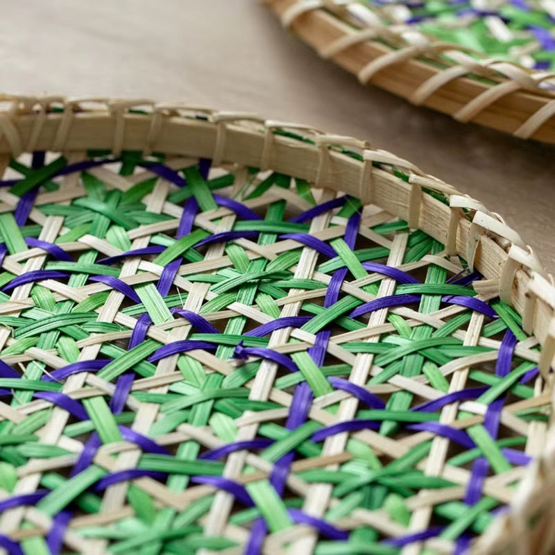 Round rattan tray with a beige, blue and green geometric pattern – close-up detail (2)