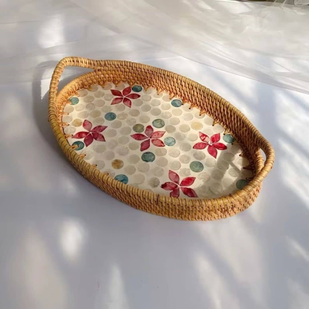 Oval rattan tray with a red floral base