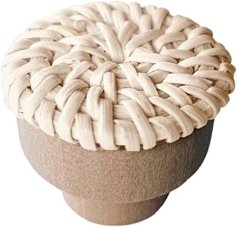 Beige cabinet pull with rattan tightly wrapped around a wood core – close-up detail