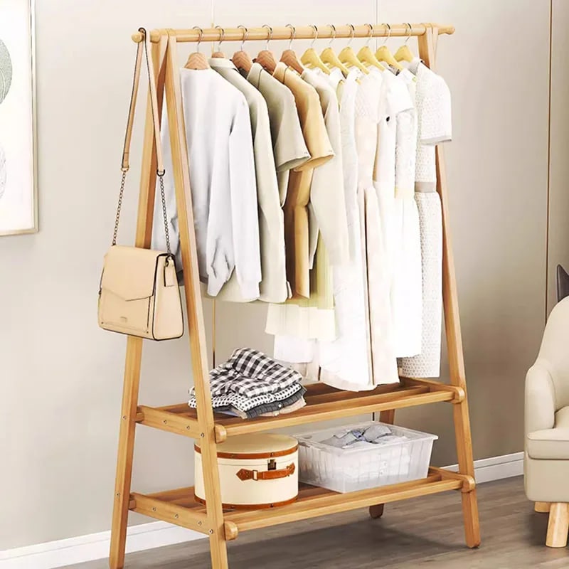Two-tier wood and bamboo clothing rack with staggered rails – shown in a room setting