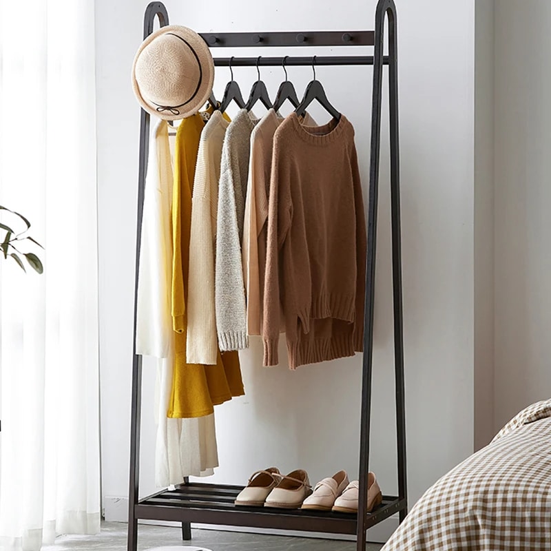 Matte black bamboo clothing rack with straight Chinese-inspired lines – shown in a room setting (3)