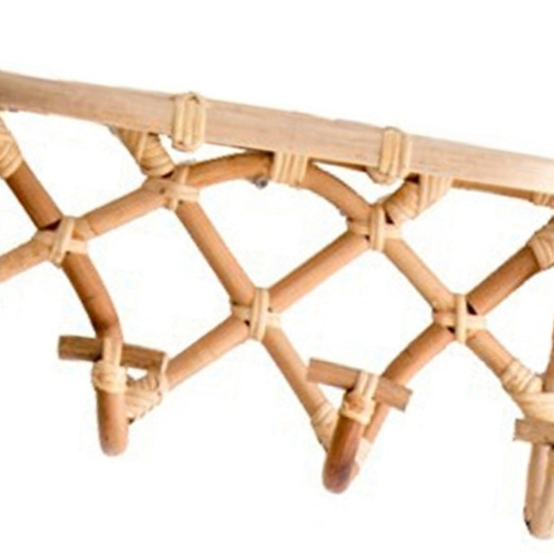 Crossed rattan wall coat rack with a top shelf and four hooks – close-up detail