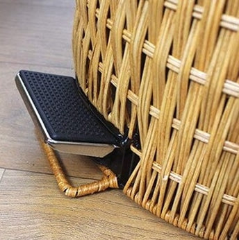 Woven rattan trash can with a foot pedal – close-up detail