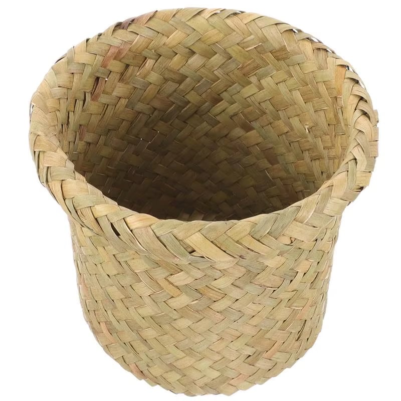 Compact round rattan wastebasket in a sand color