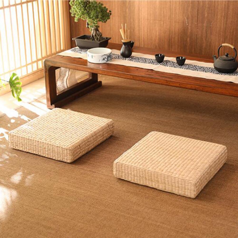 Square flat rattan pouf with a tight braid – shown in a room setting (3)